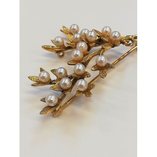 119 - A 9ct gold pearl set foliate spray brooch, designed as a branch with textured leaves and cultured pe... 