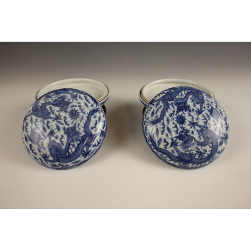 418 - A pair of Chinese porcelain blue and white boxes and covers, Qianlong seal mark, each circular box p... 