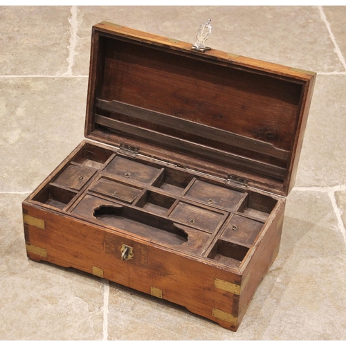 594 - A 19th century and later brass bound elm apothecary chest, the hinged cover applied with brass corne... 