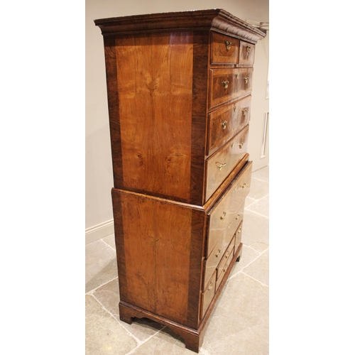 612 - A George I figured walnut chest on chest, early 18th century, the moulded cornice above two short an... 