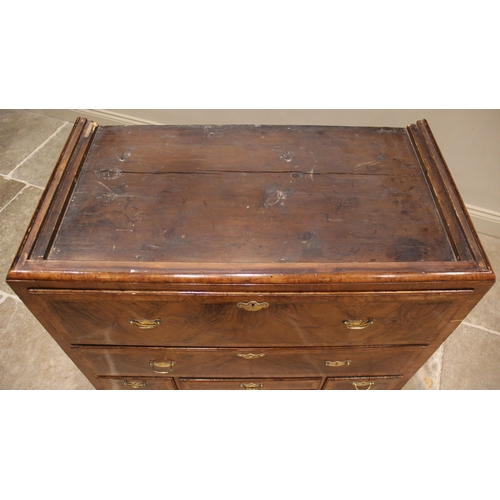 612 - A George I figured walnut chest on chest, early 18th century, the moulded cornice above two short an... 