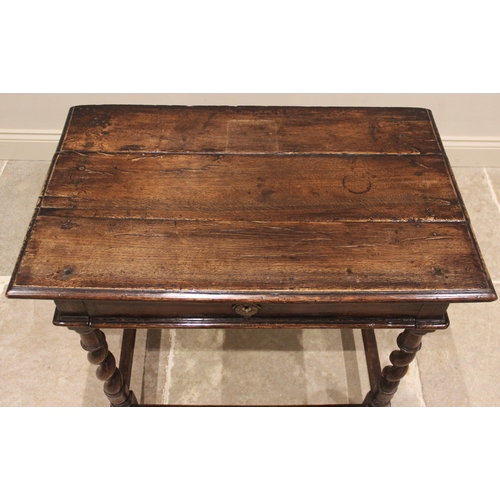 616 - An oak side table, early 18th century, the moulded three plank top over a single frieze drawer, upon... 