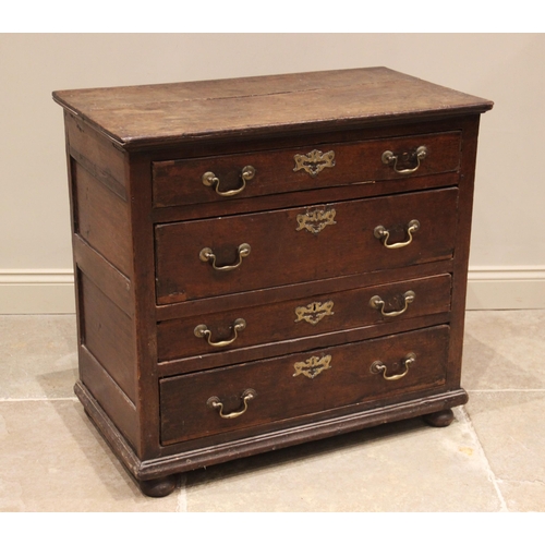 622 - An oak chest of drawers, 18th century and later, the plank top above an arrangement of four long dra... 