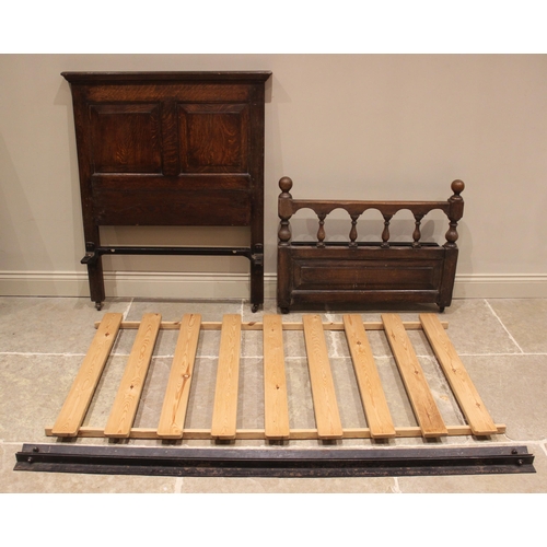 623 - A pair of oak single beds, 18th century and later constructed, each with a panelled headboard and ba... 