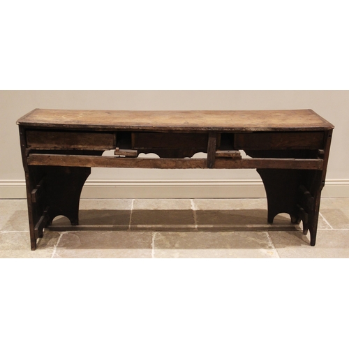 624 - An elm and oak dresser base/work bench, 18th century and later, the plank top over three frieze draw... 