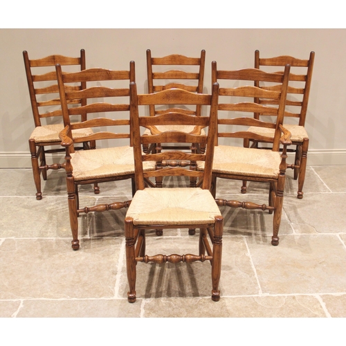 627 - A 17th century style honey oak refectory table, 20th century, the rectangular top above a nulled fri... 