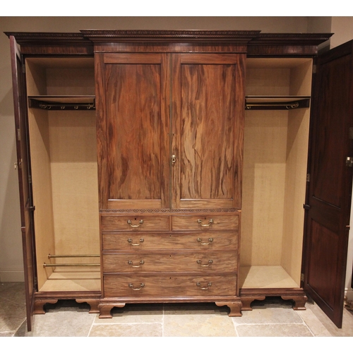 633 - A large Chippendale revival mahogany breakfront wardrobe, early 20th century, the moulded dentil cor... 