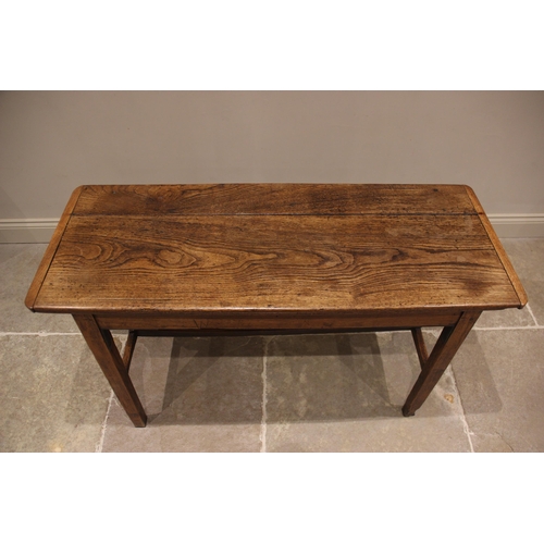 635 - An elm plank top side table, probably French, early 19th century, the cleated top raised upon legs o... 