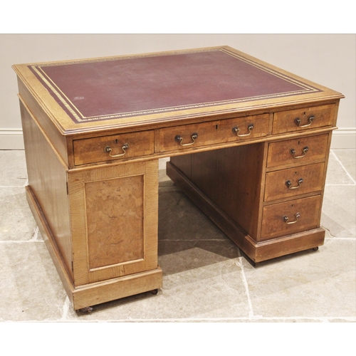 660 - A late Victorian oak and pollard oak twin pedestal partners desk, the rectangular moulded top inset ... 