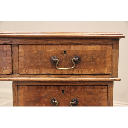 660 - A late Victorian oak and pollard oak twin pedestal partners desk, the rectangular moulded top inset ... 