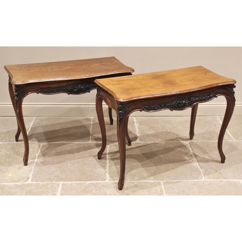 661 - A pair of Louis XV style walnut console tables, early 20th century, each with a moulded serpentine t... 