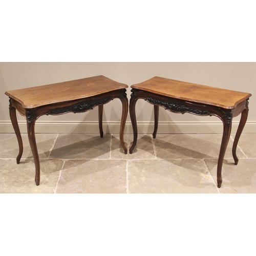 661 - A pair of Louis XV style walnut console tables, early 20th century, each with a moulded serpentine t... 