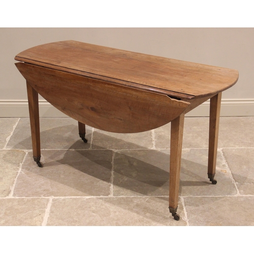 665 - A cherry wood Pembroke table, mid 19th century, possibly French, the oval drop-leaf top upon legs of... 