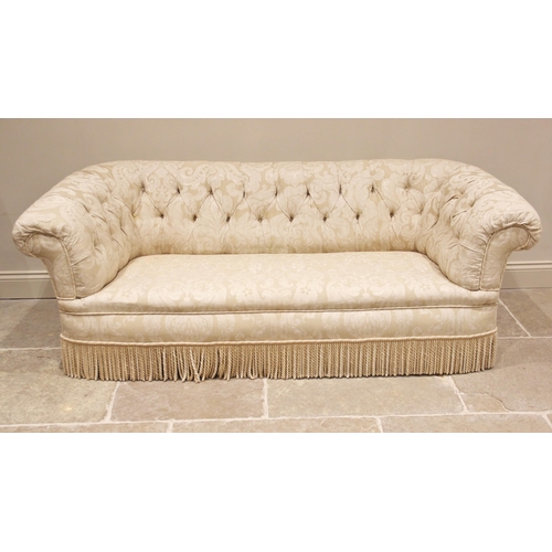 666 - A Victorian country house button back Chesterfield sofa, upholstered in foliate damask fabric, of ty... 