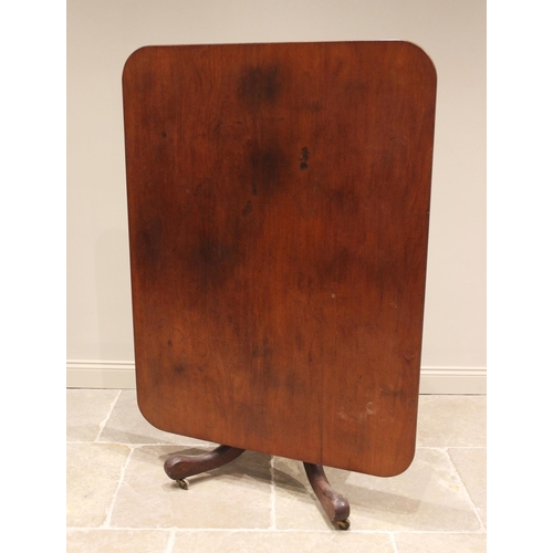 670 - A 19th century mahogany centre/breakfast table, the rectangular tilt top with rounded corners upon a... 