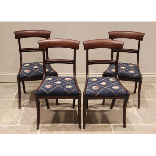 675 - A set of four mahogany rail back dining chairs, mid 19th century, each chair with a concave rail bac... 