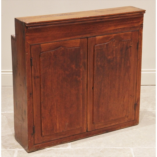 681 - A Victorian stained pine wall mounted ecclesiastical cupboard, of inverted square form, the pair of ... 