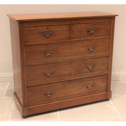 682 - A late Victorian satin walnut chest of drawers, the rectangular moulded top above an arrangement of ... 