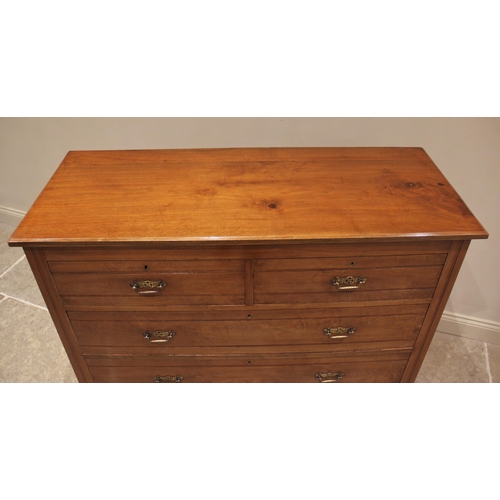 682 - A late Victorian satin walnut chest of drawers, the rectangular moulded top above an arrangement of ... 