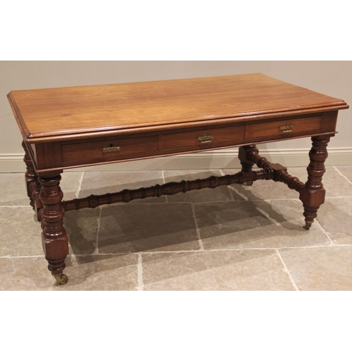 687 - A late Victorian walnut library/writing table by Maple & Co, the rectangular thumb moulded top above... 