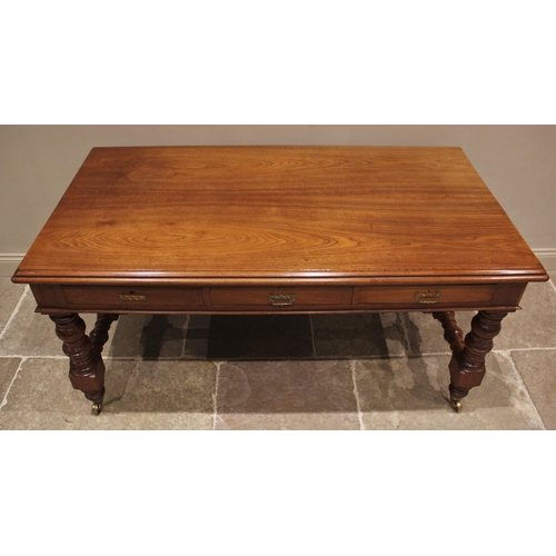 687 - A late Victorian walnut library/writing table by Maple & Co, the rectangular thumb moulded top above... 