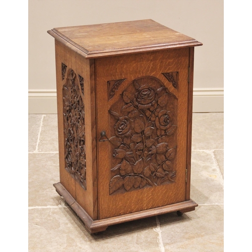 694 - A carved oak side cabinet, late 19th/early 20th century, the rectangular moulded top over a single d... 