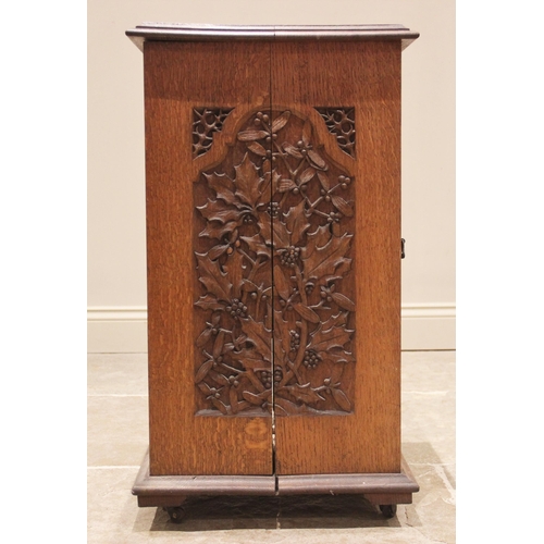 694 - A carved oak side cabinet, late 19th/early 20th century, the rectangular moulded top over a single d... 