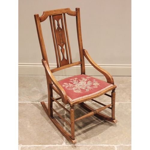 700 - A Secessionist/Art Nouveau beech rocking chair, by Ray & Miles, Liverpool, early 20th century, the p... 