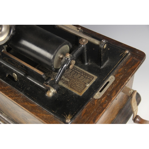 561 - An oak cased Thomas A. Edison cylinder phonograph, early 20th century, the riveted patent plaque car... 