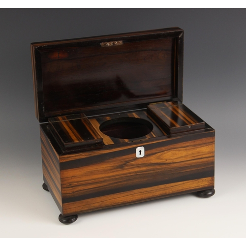 592 - A mid 19th century coromandel tea caddy, of rectangular form, opening to a central aperture and two ... 