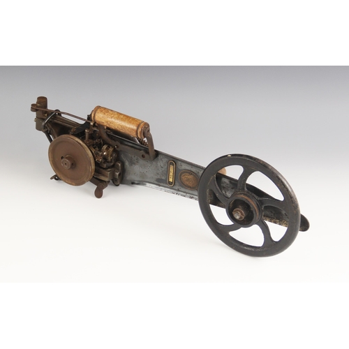 569 - A Singer hand-cranked carpet stitcher, early 20th century, stamped 