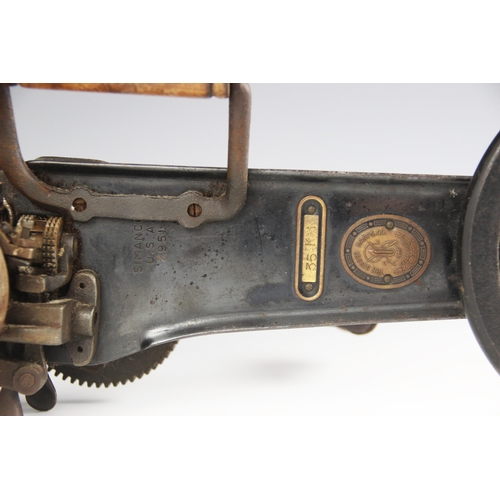 569 - A Singer hand-cranked carpet stitcher, early 20th century, stamped 