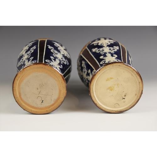 467 - A pair of Royal Doulton vases, early 20th century, of inverted baluster form, the body with relief m... 