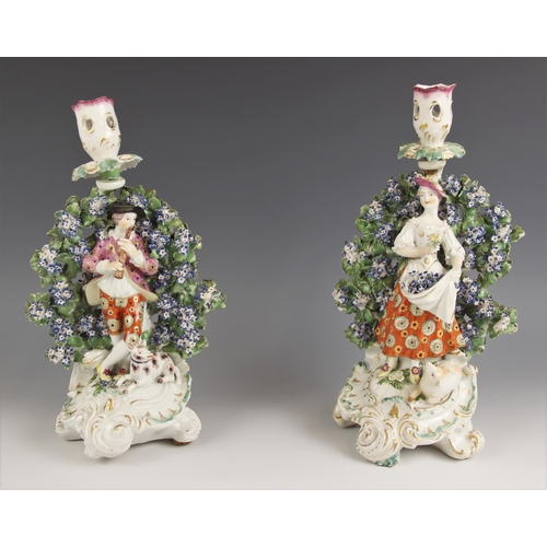 475 - Two porcelain florally encrusted bocage figural candlestick figures, probably Derby late 18th centur... 