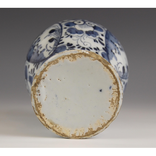 476 - A Delft tin glazed earthenware blue and white vase, of inverted baluster form with raised neck and s... 