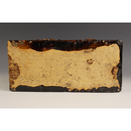 477 - An English treacle glazed earthenware tobacco box of large proportions, 19th century, the cover mode... 