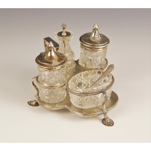 62 - A Victorian cut glass silver mounted cruet set, Henry Manton, Birmingham 1876, comprising pepperette... 