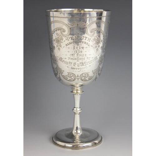 67 - A Victorian silver trophy cup, Josiah Williams & Co, London 1892, of tapered cylindrical form on kno... 