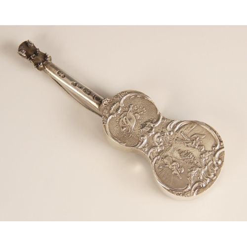 102 - A Dutch silver miniature model of a guitar, of typical form, embossed with cherubs playing instrumen... 