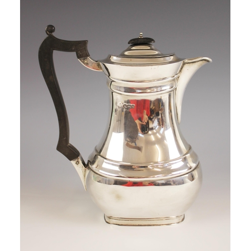 107 - A George V silver coffee pot, William Hutton & Sons, Sheffield 1919, of baluster form with ebonised ... 