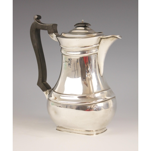 107 - A George V silver coffee pot, William Hutton & Sons, Sheffield 1919, of baluster form with ebonised ... 