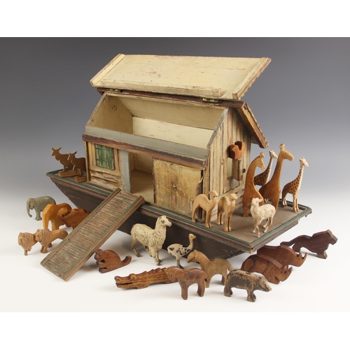 533 - A hand made wooden Noah’s Ark, probably early 20th century, hand painted in a naive folk art style, ... 