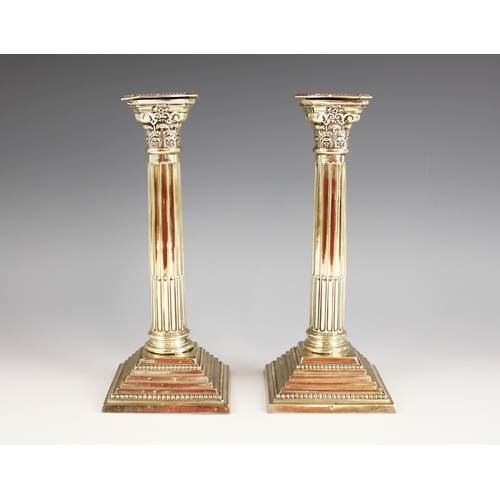 79 - A pair of George V silver candlesticks, marks for 'WS', Birmingham 1921, the weighted stepped square... 