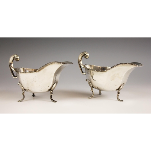 86 - A pair of George V silver gravy boats, Thomas Latham & Ernest Morton, Birmingham 1912, each of typic... 