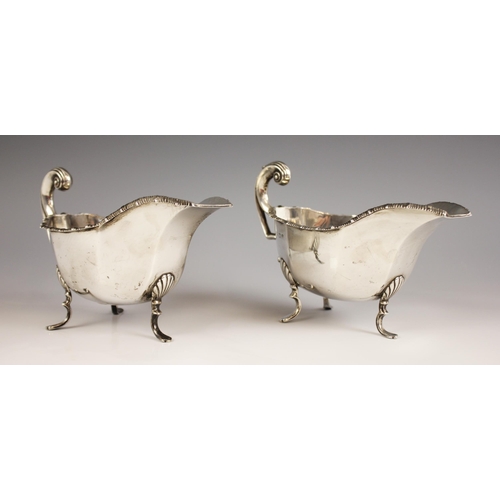 86 - A pair of George V silver gravy boats, Thomas Latham & Ernest Morton, Birmingham 1912, each of typic... 