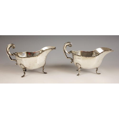 86 - A pair of George V silver gravy boats, Thomas Latham & Ernest Morton, Birmingham 1912, each of typic... 