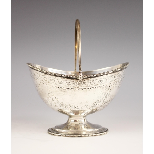 91 - A Victorian silver swing-handled bon-bon dish, London 1868 (makers mark worn), the oval bowl raised ... 