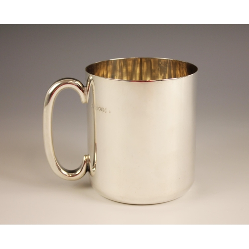 97 - A Victorian silver mug, Thornhill & Co, London 1885, of cylindrical form with C-scroll handle, inscr... 