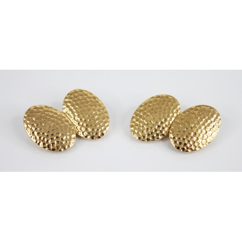 129 - A pair of 18ct gold cufflinks, each oval link with hammered detail, 18mm x 13mm, belcher link chains... 