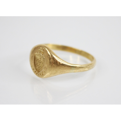 133 - An early 20th century 18ct gold signet ring, the oval shaped head with a crest depicting a griffin u... 